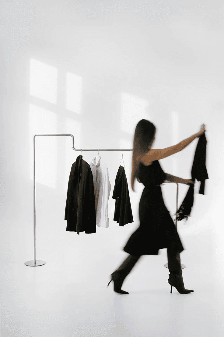 Fashion model walking in dark outfit