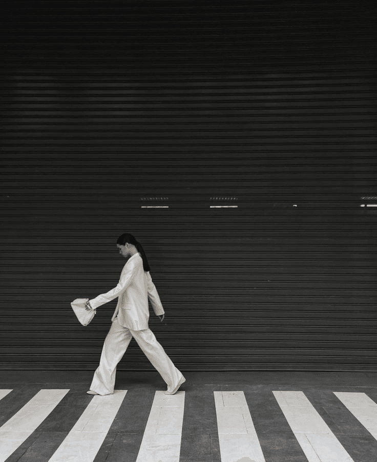 Model walking on zebra crossing
